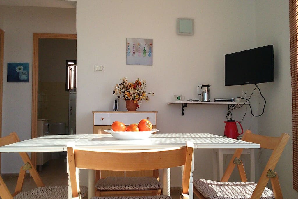 Cozy living/ dining area with TV