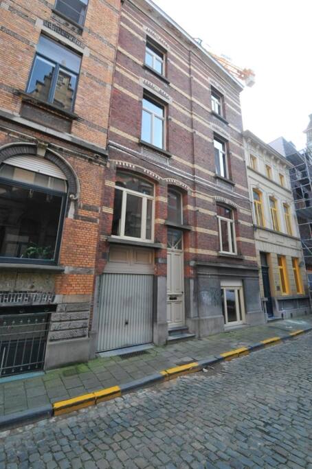 a bedroom in the top of this building on the 4th floor (60 steps)