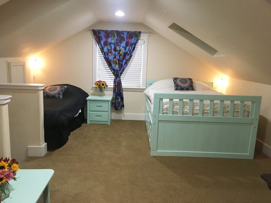 First room at the top of the stairs with one double bed, and one twin extra long bed.