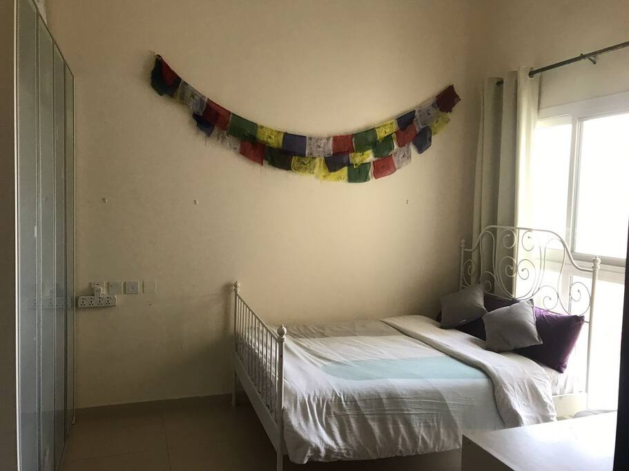 The Rainbow and White Room..decorated with Nepal Peace flags.