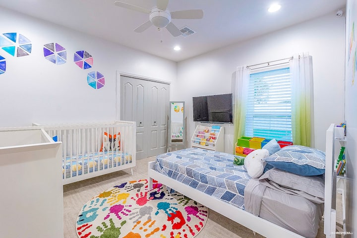 [Bedroom 4] Kids room with a single twin bed, a toddler bed, and a crib