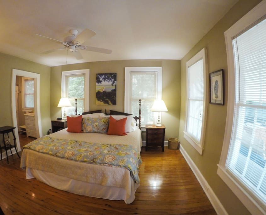 Master bedroom with a walk in closet and private bathroom