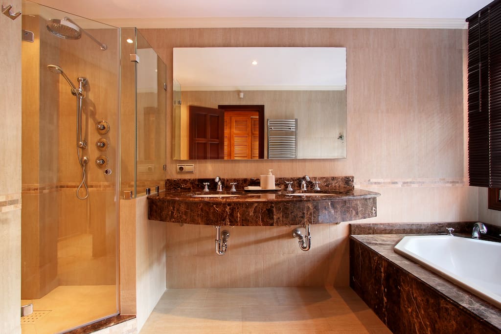 Luxurious en-suites feature polished marble, Italian stone, double-ended bath tubs, rain showers and fine toiletries.