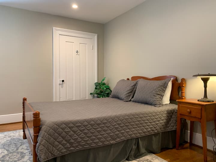 The Radio Room features a large queen bed, nightstand, dresser, and a desk. You'll find an original mushroom lamp, rotary telephone, and what can only be called the most over-powered desk lamp ever made, over 150 watts!!