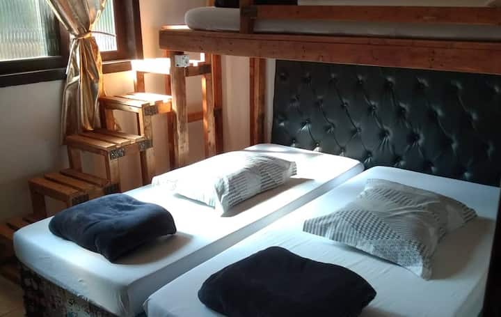 Single bedroom. Note this room is also for couples, because the  room has two single mattresses together on a wooden board.