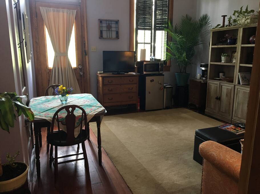 Private living space with couch and small dining table