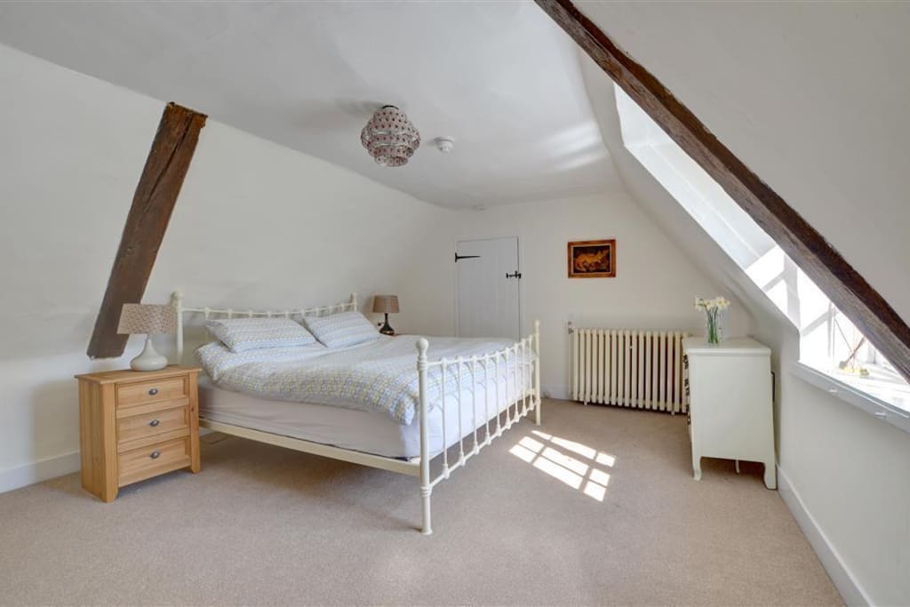 Large Double Bedroom with kingsize bed and view of the gardens