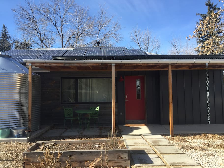 Modern net-zero home has solar PV, solar thermal and ground source heat pump.