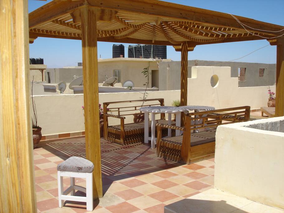 Large communal roof terrace, with sunbeds and pergolas