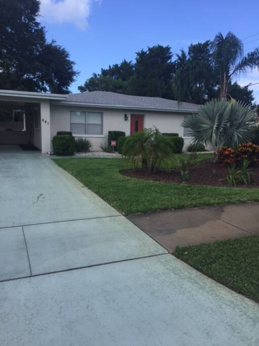 Landscaped yard in a walkable neighborhood.