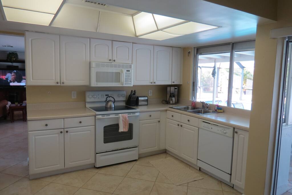 Fully Equipped Kitchen with View of Pool, Pass through Window