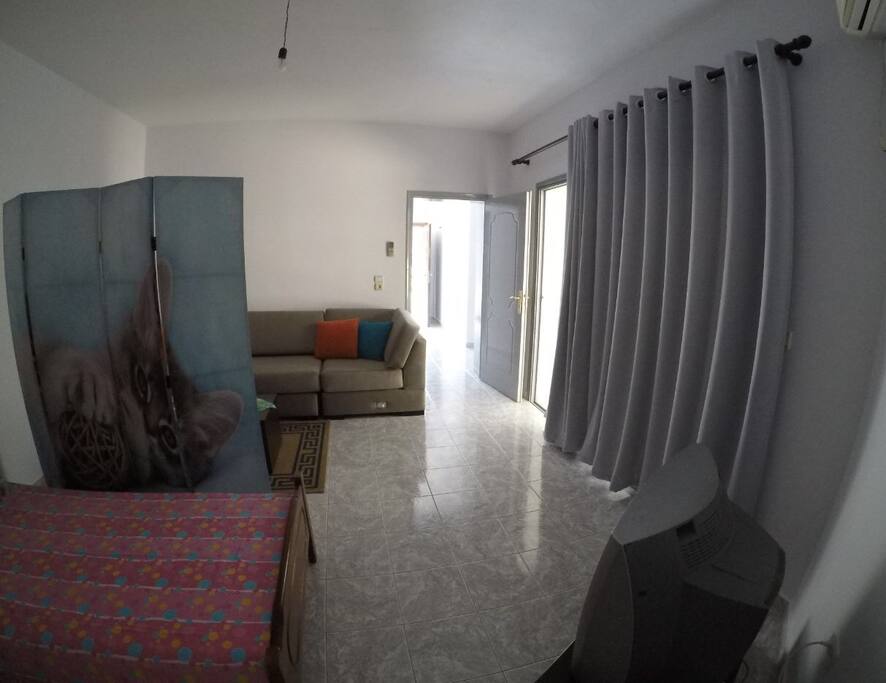 Living Room with Sofa and two single beds
