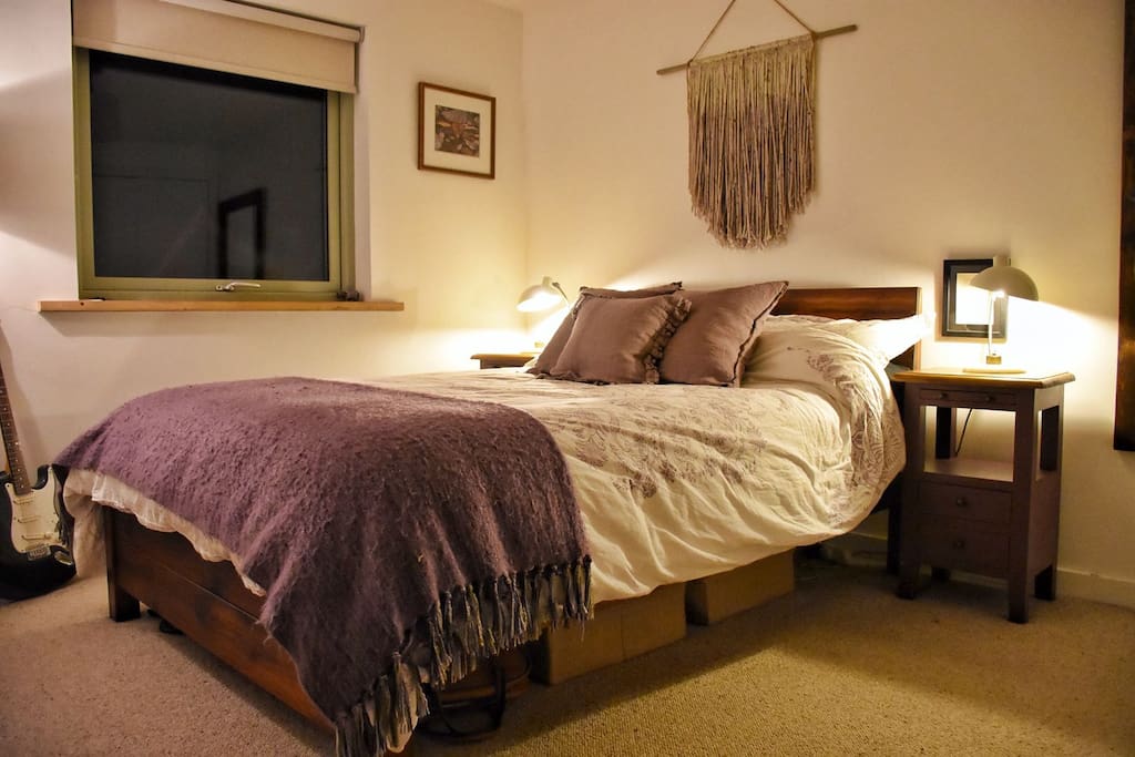 The main bedroom with comfy double bed, built in wardrobes and a beautiful view onto the garden.