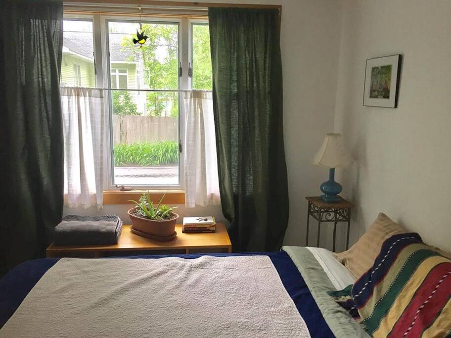 Large window with clothing and towel storage beneath