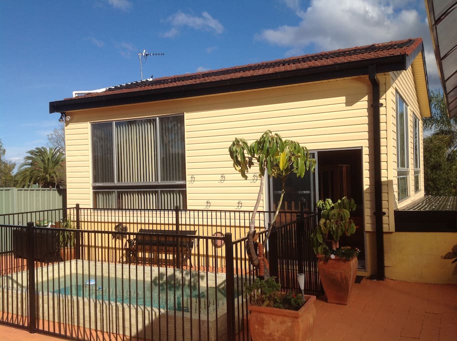 Granny Flat view from back yard including pool area and separate entry .