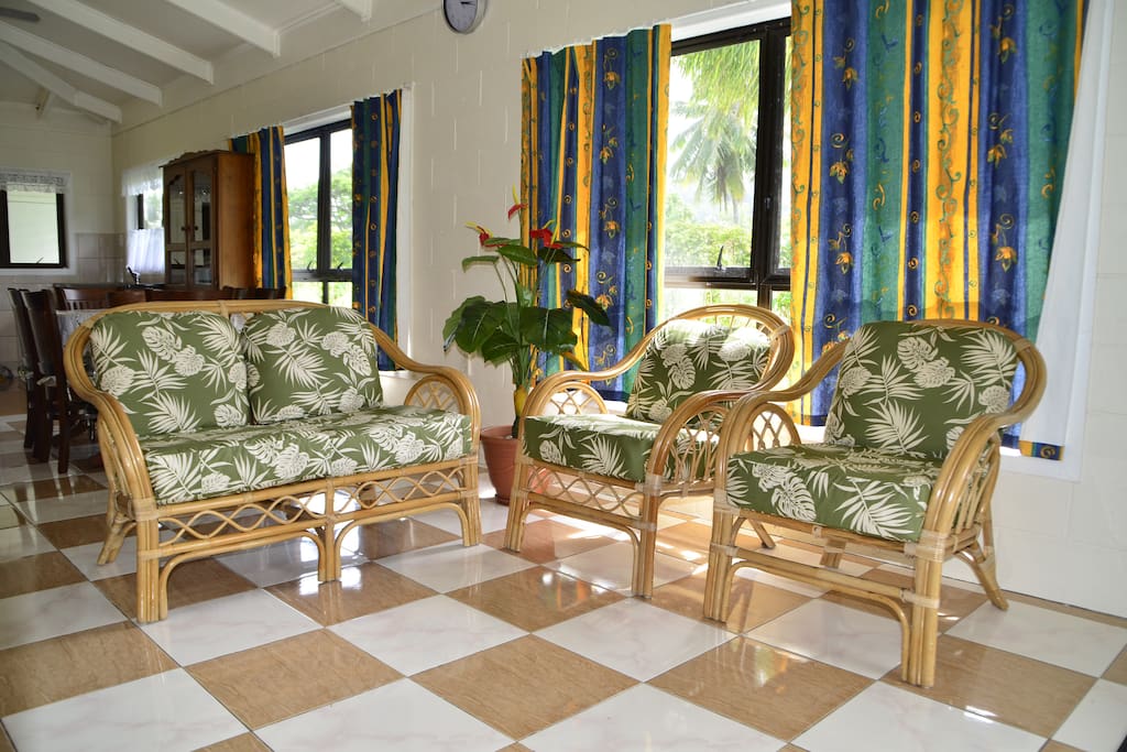 Sitting Room ~ a nice cool place for you to enjoy the cool breeze from surrounding windows.