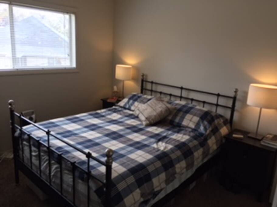 Sunny bedroom with queen bed