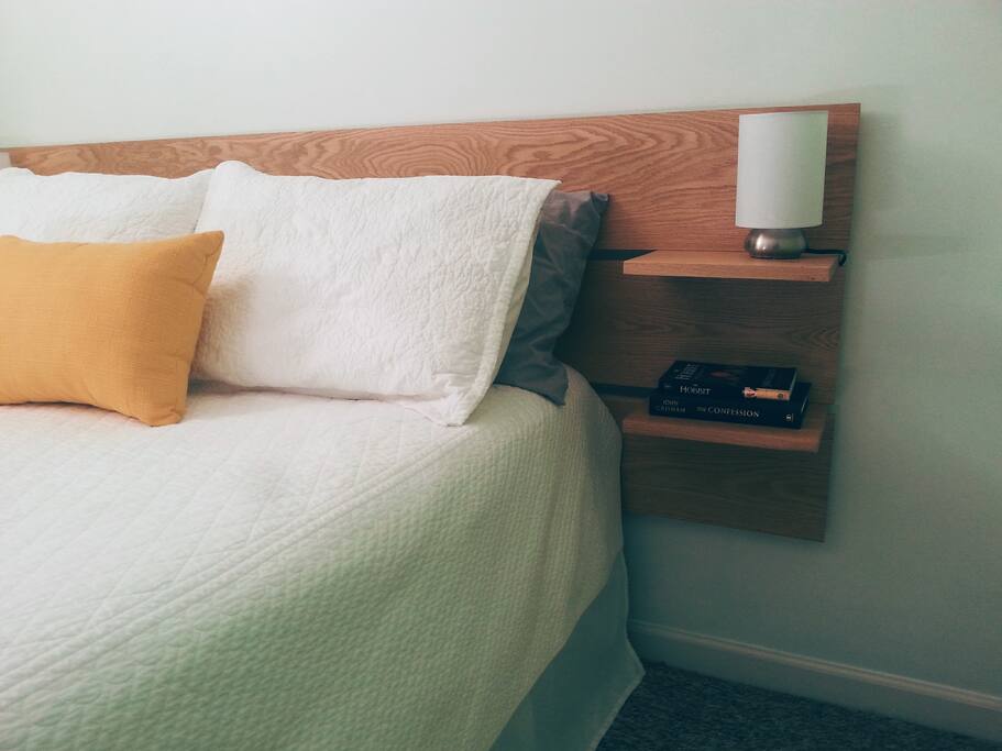 This new homemade headboard gives the cozy room a contemporary spin.