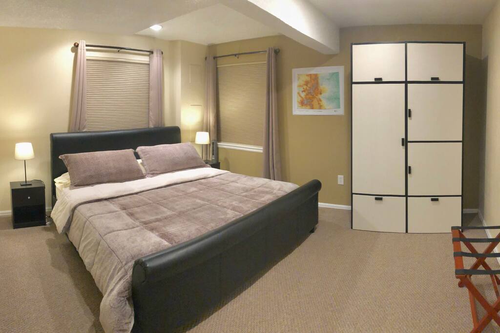 King bed with various pillow styles for your sleeping needs. Blackout curtains and white noise fan to add to your comfort.
