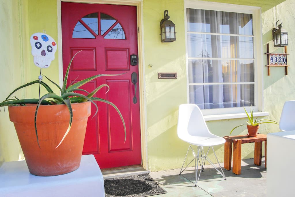 A happy home-away-from-home. Front porch for sitting, red door for fun.