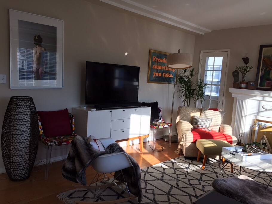 Large flat-screen tv is wired with Amazon TV and Apple TV to catch your favorite shows.