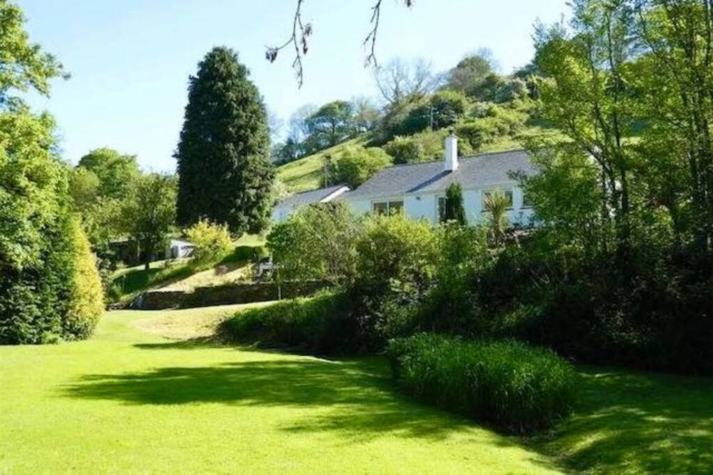 Private extensive gardens and woodland.