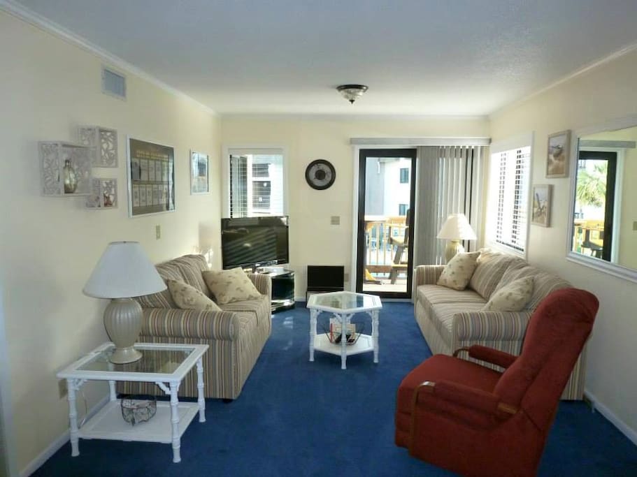 Entire Condo is Newly Renovated! Large Living Room with Lots of Seating and Pull-Out Sofa Bed.