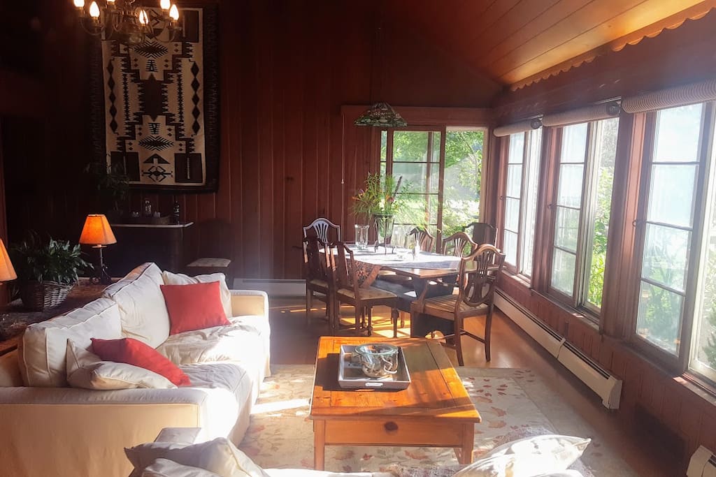 The great room/dining room has a full wall of windows to enjoy the magnificent views. This is part of your private space during your stay. We can put a fire in the hearth for you when the weather is cold outside.