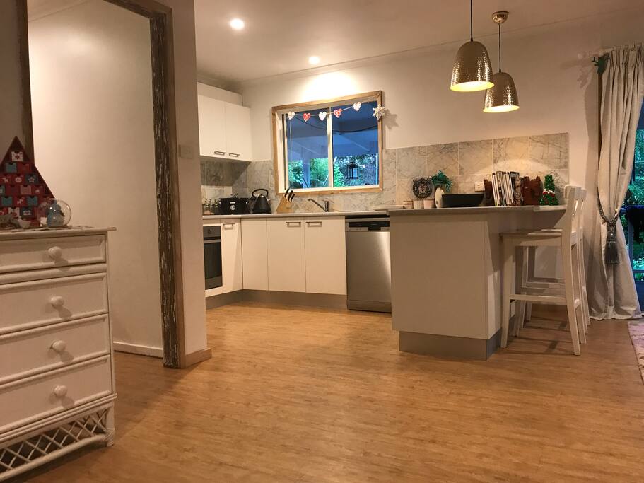 Modern kitchen with induction stove, dishwasher, fridge and freezer, and all pots, pans etc provided.