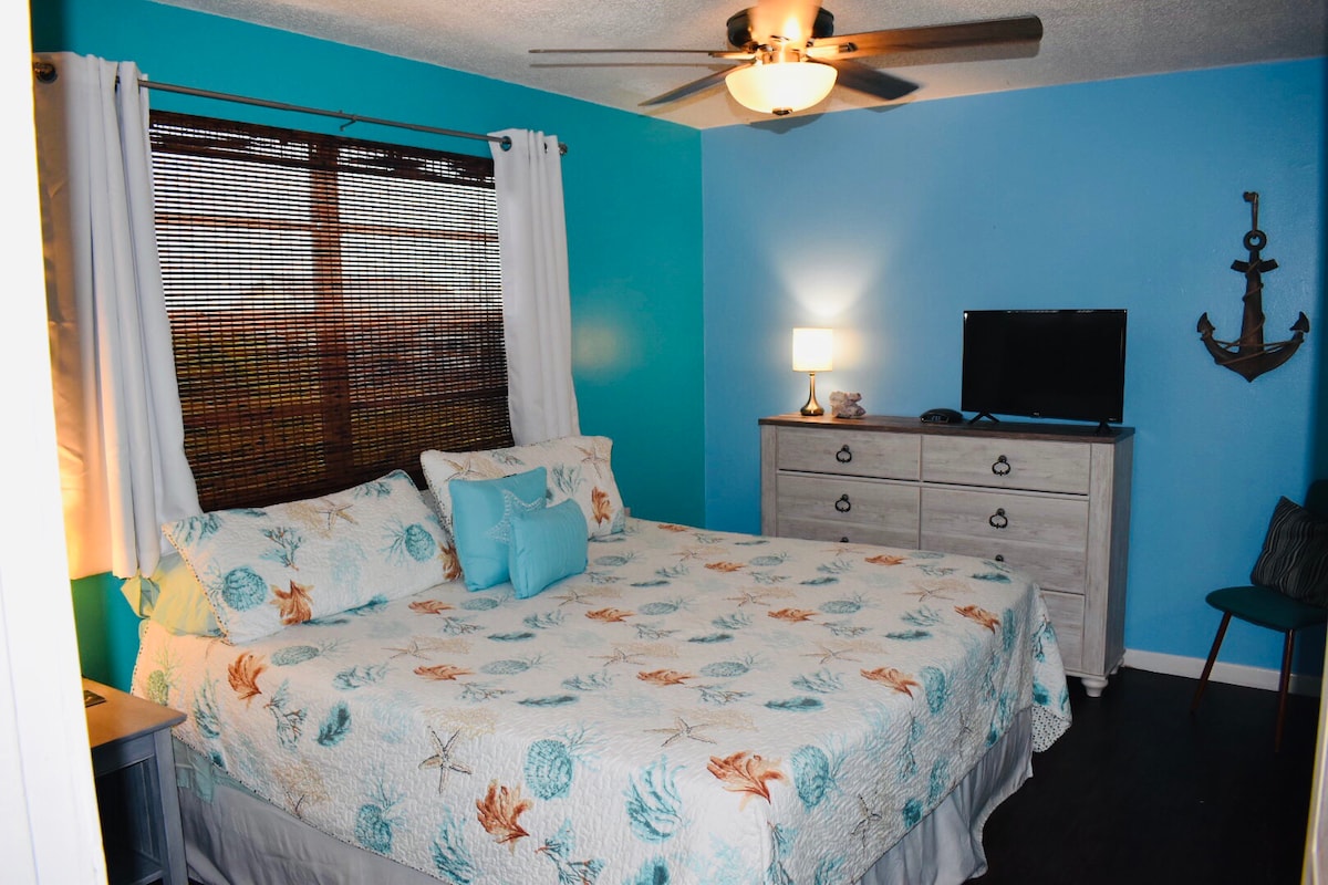 Bedroom 1 in Unit #2 with King size bed, blackout curtains and smart TV