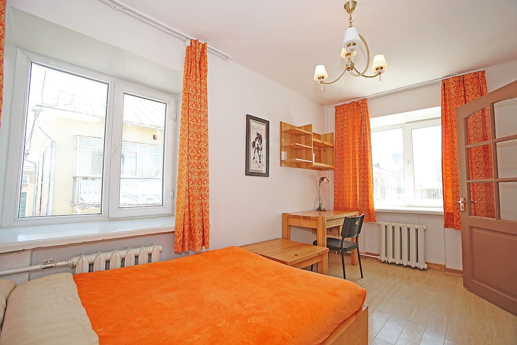 The bedroom is clear, bright, with a lovely wooden desk as well as storage and a kind bed for your comfort.
