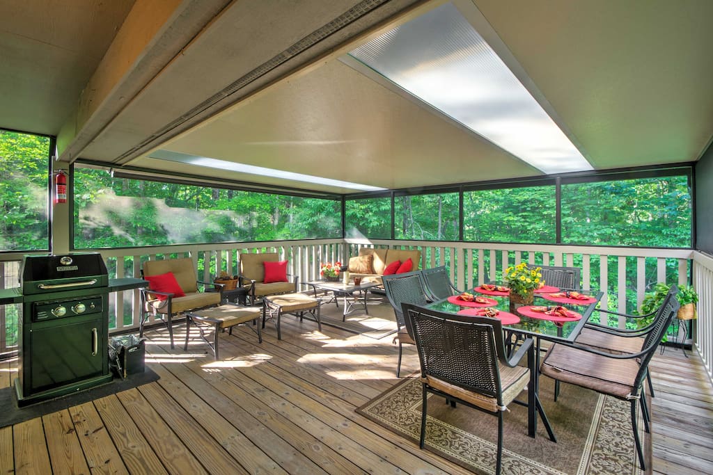 Lounge in the outdoor living space, complete with a screened in porch.