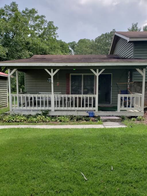 The front porch with the swing to sit and watch the world go by