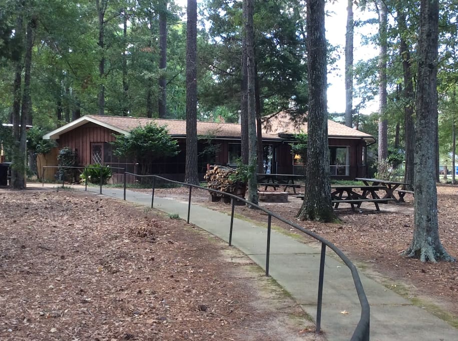 Paved sidewalk with handrail from the house to the lake