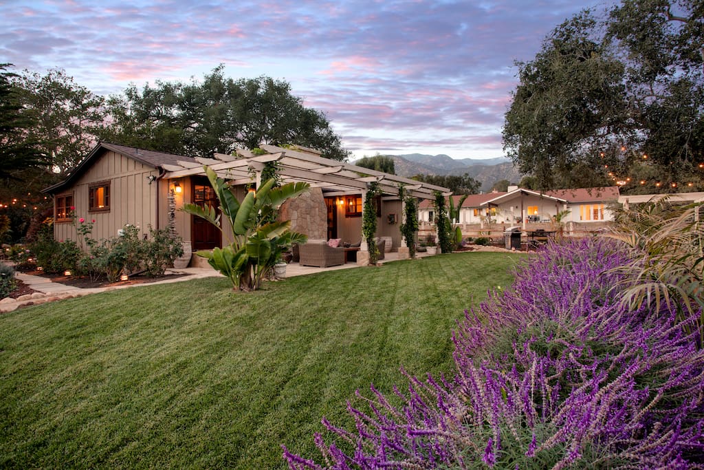 Back patio with comfy furniture and fountains.
