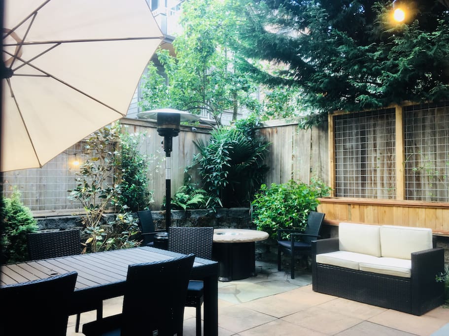 Private backyard garden with firepit, space heater, and bbq grill. Should see it at night all lit up!