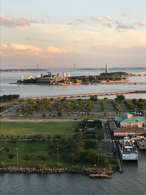 View of Statue of Liberty, Ellis Island, and Verrazano Narrows Bridge from living room
