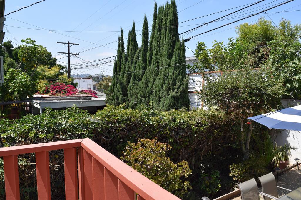The view from your private deck and entry overlooking backyard and sunsets.