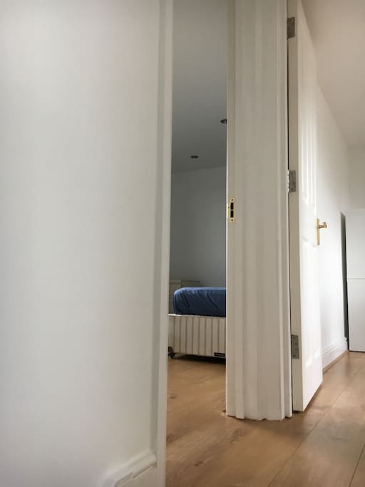 wall dividing bedroom from living room.