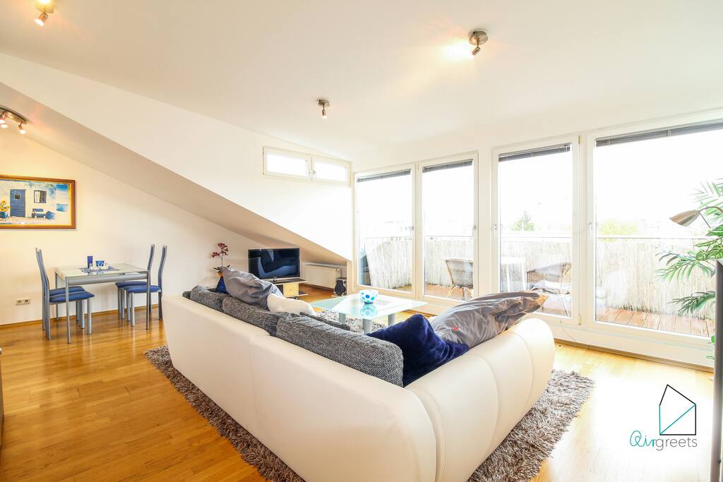 From the living room you can step onto the balcony from which you have a wonderful view of the city.