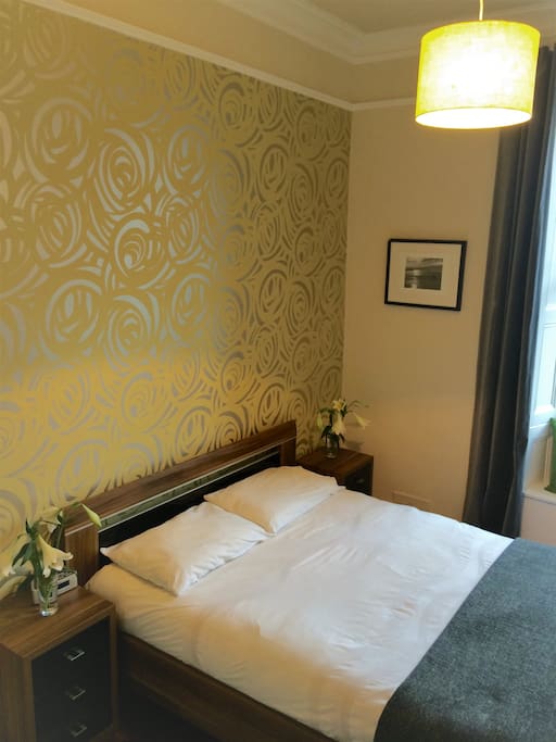 The luxurious bedroom has beautiful contemporary furniture with ample storage and more than ample comfort!