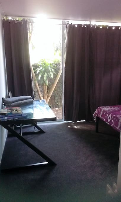 Main bedroom, small TV, plenty of space, small wardrobe