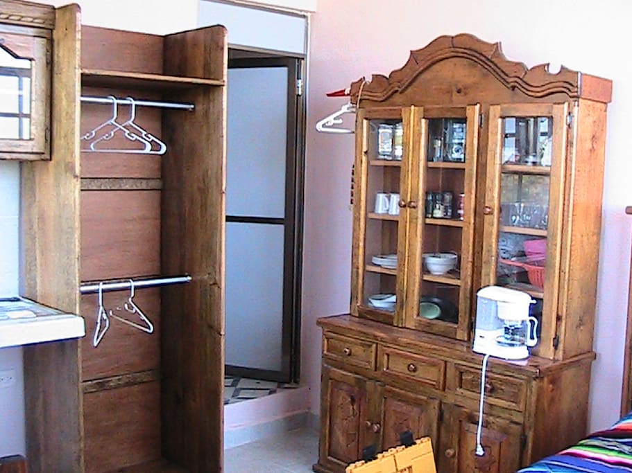 The clothes closet and entrance to the bathroom