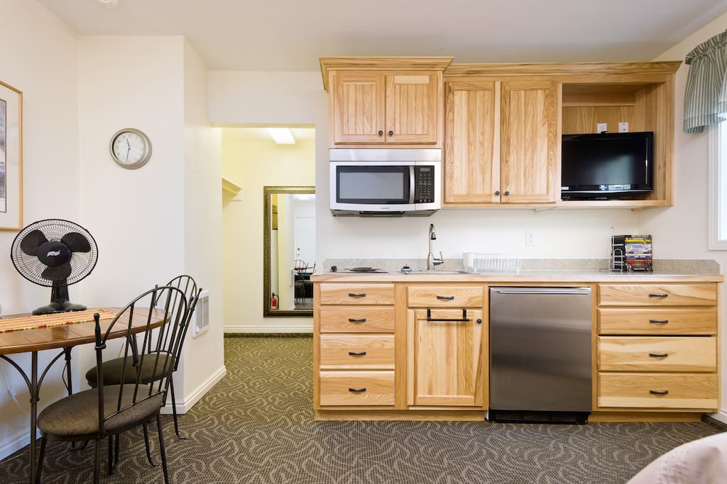 Watch a movie. Relax. Keep those beverages cold with an over sized mini fridge under the counter top.