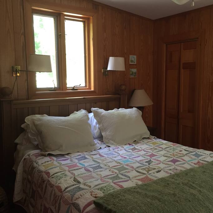 This queen sized bed is so cozy! The quality linens will lull you to sleep.