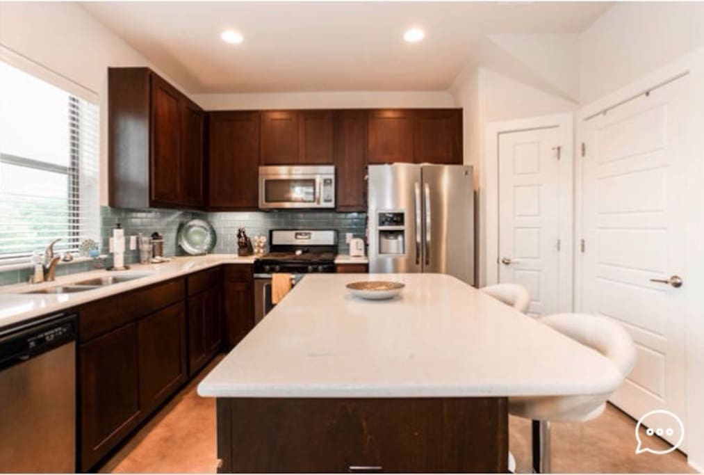 Island kitchen with bar stools for entertaining
