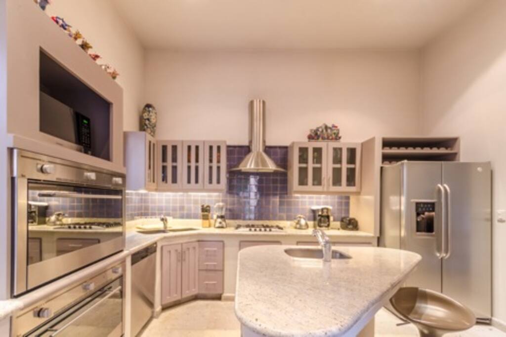 Spacious kitchen, two ovens, microwave, dishwasher, large pantry, garbage disposals, two sinks.