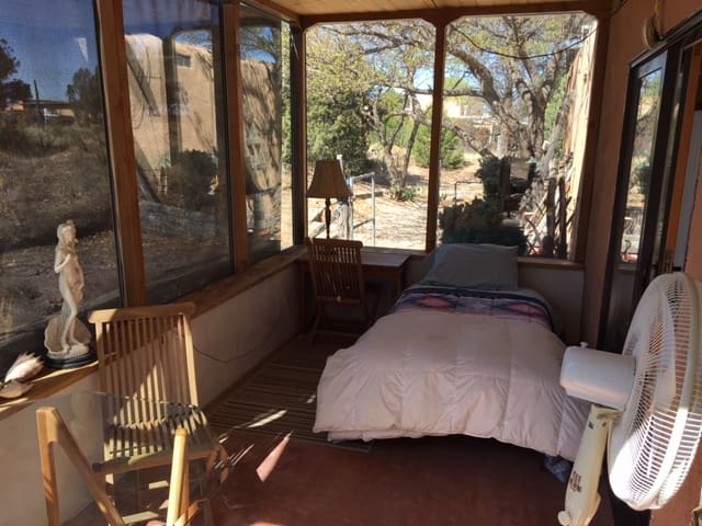 E.  Single bed in Sunroom