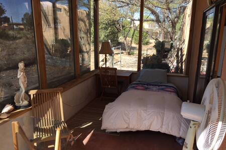 E.  Single bed in Sunroom