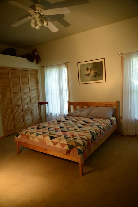 Spacious bedroom with beautiful art